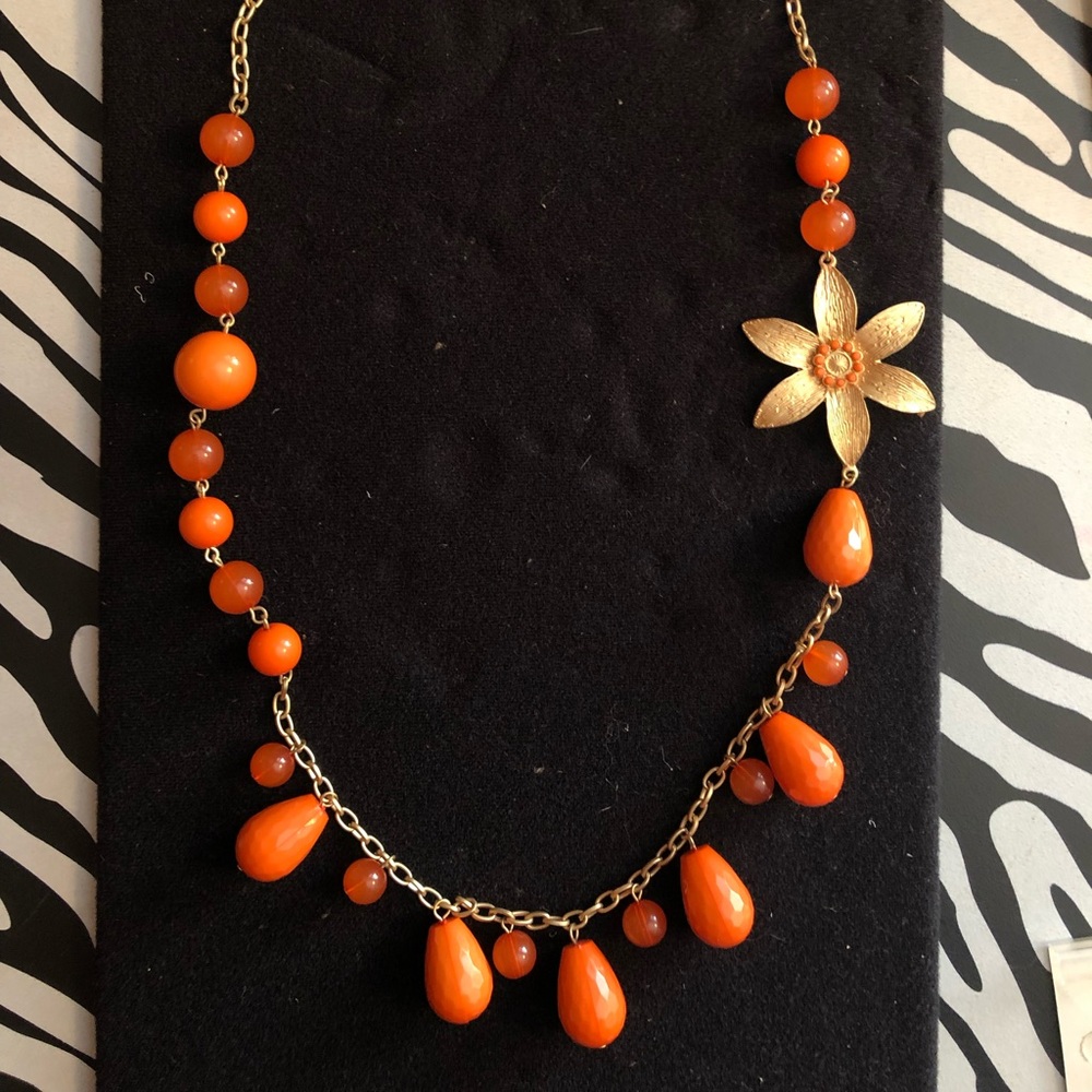 Orange beaded hoop earrings and necklace